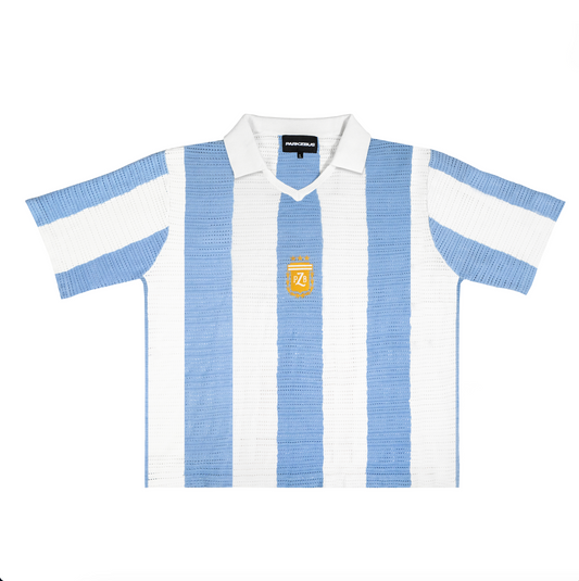 Front view of Argentina-inspired retro knit football shirt featuring vertical sky blue and white stripes, a white polo collar, and a gold embroidered crest.