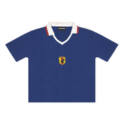 Front view of Japan 1998 "Samurai Blue" Retro Knit Football Shirt featuring a central woven crest and contrast white V-neck collar.