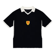ParkzBus navy waffle-knit polo shirt with cream v-neck collar, sleeve cuffs and side panels, featuring an embroidered yellow shield crest with a red lion rampant and "No Scotland No Party" text